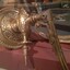 Bracket base has sperical boarder around circumference, geometric  pattern around centre.