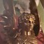 Figure's hair is crinkled, and there is a bodice of feathers moulded into the metal.