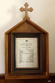 Document, framed in wood, listing many of the donors for items in the chapel