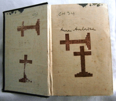 Inside front cover's inscription and stamps of the Cross symbol