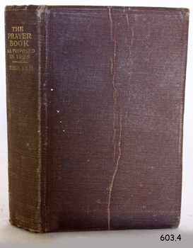 Brown cloth covered hardcover book with gold lettering on spine