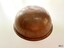 Beaten copper bowl is almost ball-shaped, with a rolled opening