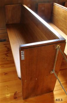 This pew is adjacent to the south wall and in the front row.