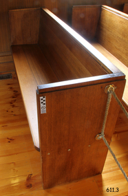 This pew is adjacent to the south wall and in the front row.