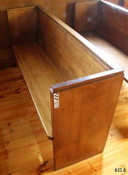 Pew is adjacent to the south wall.