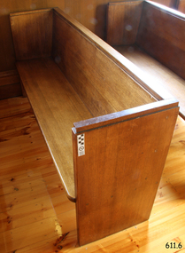 Pew is adjacent to the south wall.