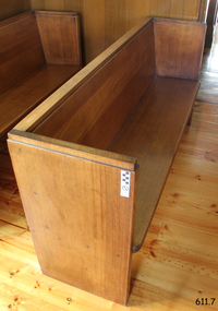 Pew is adjacent to the norht wall, and along the west side of the entry into the Chapel.