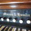Close-up view of the embossed gold lettering of the maker's name