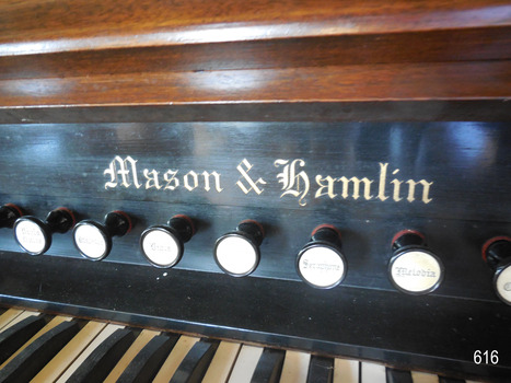 Close-up view of the embossed gold lettering of the maker's name