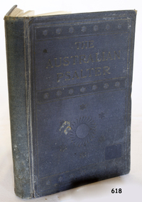 Blue fabric covered hard cover book with impressed text and image on front. Title is embossed gold.