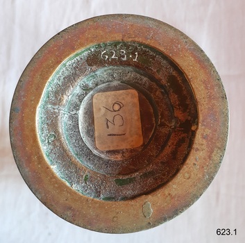 Hollow concave base has paper sticker