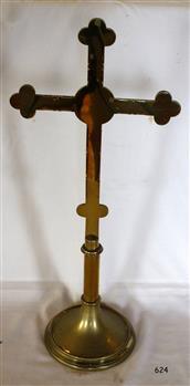 Brass cross on round base with two bulbous knobs on the stem