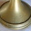 Brass base has an inscription