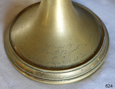 Brass base has an inscription