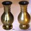 Two bulbous brass vases with wide mouths and two rings around their necks