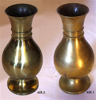 Two bulbous brass vases with wide mouths and two rings around their necks