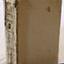 Cover is cardboard with remnants of dark blue. The cover is missing from the spine, exposing the folded pages..