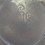 Inscription of intertwined letters is embossed on the plate
