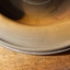 Inscription is on the lip of the plate, divided into four lines