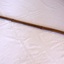 Long cane handle, pinching or grabbing tool at one end and a lever handle at the other end