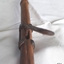 Metal mechanism is inserted into a hole in the cane and fixed into place