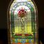 Rectangular arched coloured stained glass window