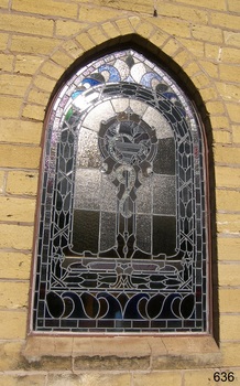 Window is fitted into sandstone church building