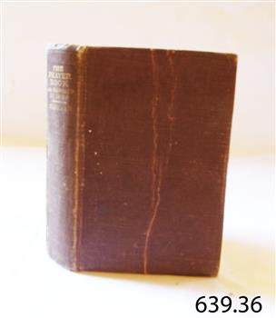 Hardcover red cover book with gold embossed title on spine