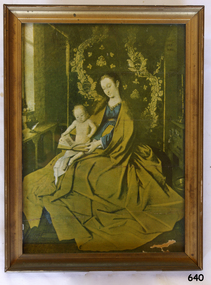 Framed print depicting an infant in the lap of a female figure