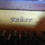 Serial number 23227 is embossed into the timber