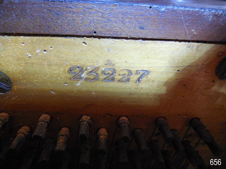 Serial number 23227 is embossed into the timber