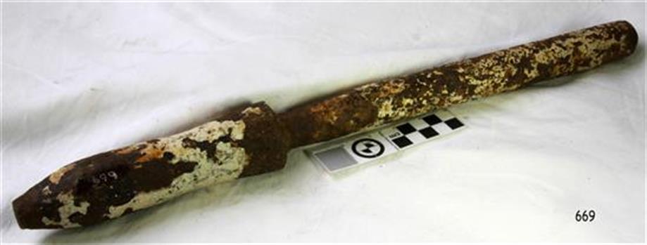 Metal belaying pin has remnants of white paint