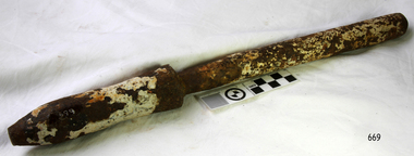 Metal belaying pin has remnants of white paint