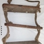 Three wooden rungs joined by lengths of knotted rope