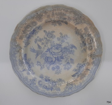 Round white plate with blue floral and bird pattern