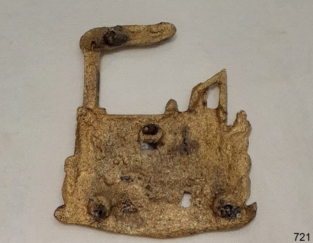Badge reverse has three holes possibly for mounting a pin or clasp