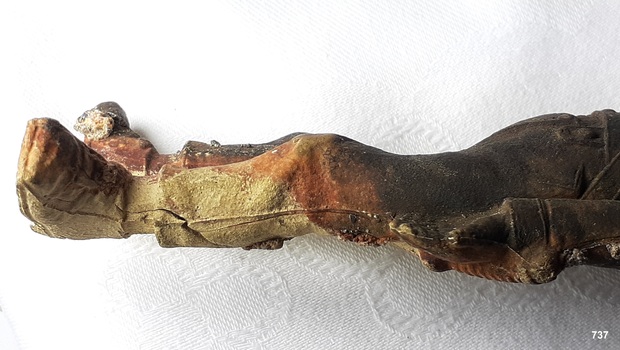 Seams along the outer left leg from a two-piece mould
