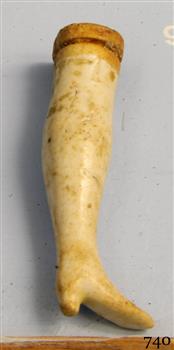 Ceramic doll]s leg, cream and beige, with shape of shoe on the end