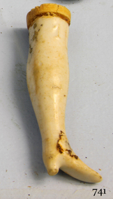 Ceramic doll's leg, cream and beige, shoe shape formed at the end of the leg