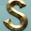 Gold coloured letter 'S', three dimensional, with nicks and scratches