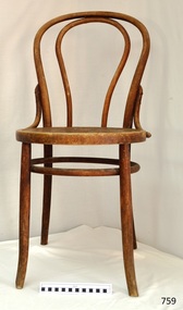 Wooden chair with rounded back and round patterned seat