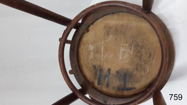 Seat has chalk and hand-painted inscriptions