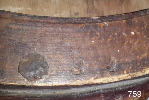 The numbers 3 and 4 have been embossed into the timber under the seat