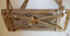 Two lengths of rope cross over underneath. Ends of each length are spliced together