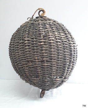 Spherical cane ball, painted black, with metal fittings at each end