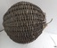 Woven cane has broken in places. It's black paint has worn off in areas. 