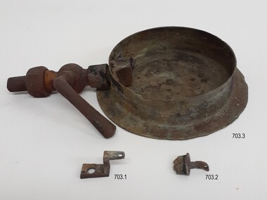Round metal frame of gauge with pipe attached, plus two parts