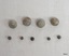 Four large and five small pieces of lead shot