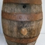 Wooden barrel with four iron bands and two bungholes; one has a stopper