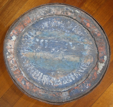 Round top end of barrel has an inscription, indecipherable